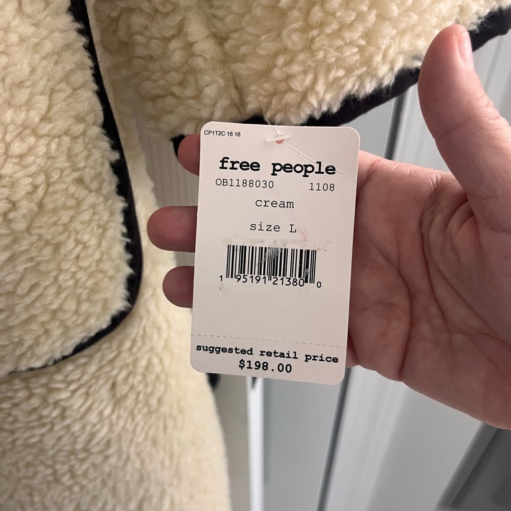 Free people house coat- size L. NWT , smoke free home. Never worn